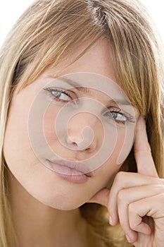 Head shot of woman thinking