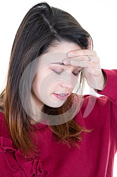 Head shot of young woman having headache with Hands on head and eyes closed