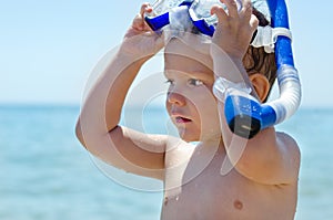 Little boy with goggles and snorkel