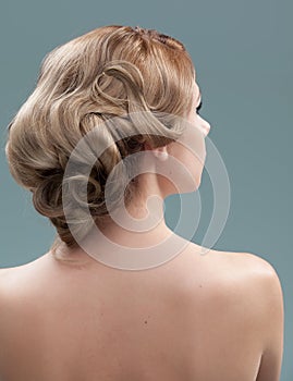 Head and shoulders back image of young woman hair