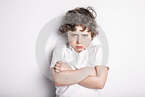 Head and Shoulders Close Up Portrait of Young boy with Sulk attitude photo