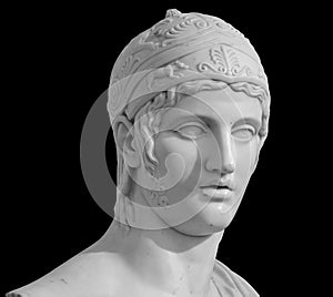 Ancient roman statue. Head and shoulders detail of the man sculpture. Antique face statue isolated on black background