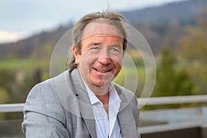 Head and shoulders portrait of an attractive middle-aged man