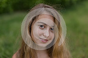 Head and shoulders portrait of smiling teenager girl