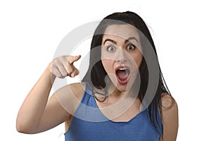Head and shoulders portrait of young beautiful hispanic woman surprised in shock and disbelief photo