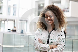 Head And Shoulders Portrait Of Young Businesswoman In Office
