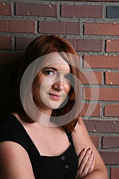 Head and shoulders of pretty auburn haired teen