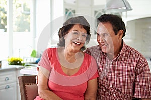 Head And Shoulders Shot Of Senior Hispanic Couple At Home