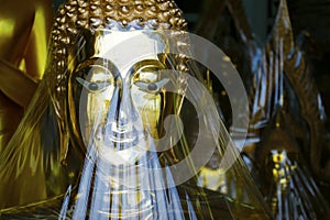 Head of statue of buddha, in buddhist temple ,with golden color