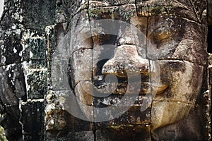 Head Staute of Bayon Temple in Angkor Thom photo