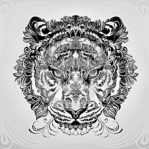 The head of a tiger in vegetal ornamentation. vector illustration photo