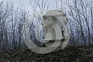 The head of the ventilation shaft of the bomb shelter in a gloomy landscape