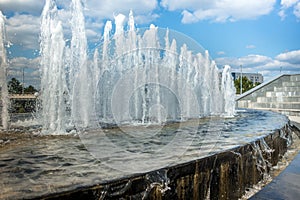 Head of water jets from fountain/Water fountain water jet over blue sky