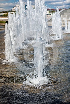 Head of water jets from fountain/Water pressure. City fountain. Jet bottom. Spray