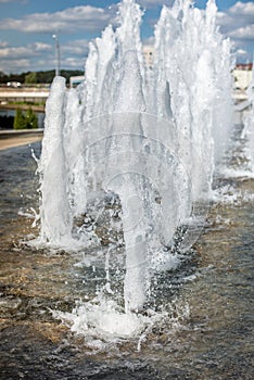 Head of water jets from fountain/Water pressure. City fountain. Jet bottom. Spray