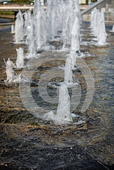 Head of water jets from fountain/Water pressure. City fountain. Jet bottom. Spray