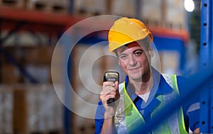 Head of worker in an auto parts warehouse, Examine auto parts that are ready to be shipped to the automobile assembly