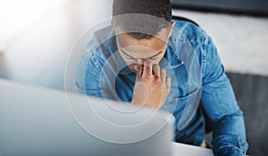 Headache, business and black man in workplace for anxiety, marketing error or mistake on project. Stress, lens flare and