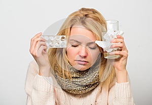 Headache and cold remedies. Flu and cold concept. Woman tousled hair scarf hold tablets blister. Guidelines for treating