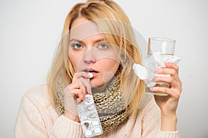 Headache and cold remedies. Woman tousled hair scarf hold tablets blister. Flu and cold concept. Guidelines for treating