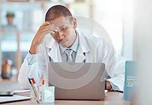 Headache, doctor and man at laptop in medical office with burnout challenge, clinic problem and stress. Frustrated