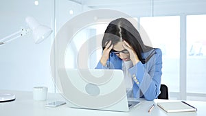 Headache and Frustration for Woman at Work