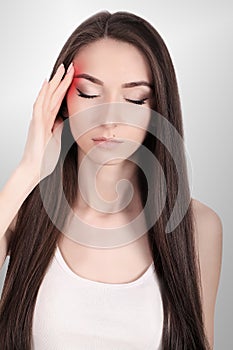 Headache, migraine and stress. The woman`s worries frustrate a woman who suffers from headache. Young beautiful girl. Treatment.