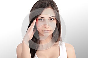 Headache, migraine and stress. The woman`s worries frustrate a woman who suffers from headache. Young beautiful girl. Treatment.