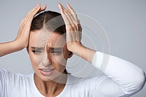 Headache Pain. Beautiful Woman Having Painful Migraine. Health photo