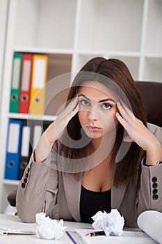 Headache and Stress at Work. Portrait of Young Business Woman at