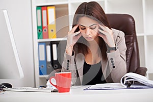 Headache and Stress at Work. Portrait of Young Business Woman at