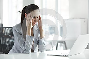 Headache and Stress at Work. Portrait of Young Business Woman at photo