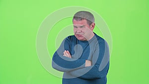 Headache torments middle aged man. Green screen