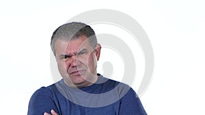 Headache torments middle aged man. White background . Close up. Slow motion