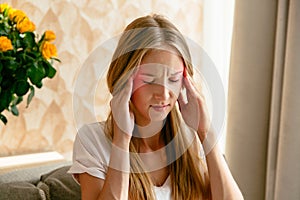 Headache of woman at home