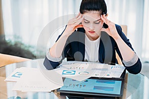 Headache work overload stress business woman paper