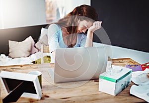 Headaches always come at the wrong moment. Cropped shot of a young businesswoman trying to work while suffering with the