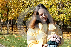 Headbands crocheted knitted in the hands of a girl on the street. Product listing for sale. Urban style. Fashion.