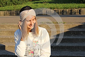 Headbands crocheted knitted on the street on the girl. Product listing for sale. Urban style. Fashion.