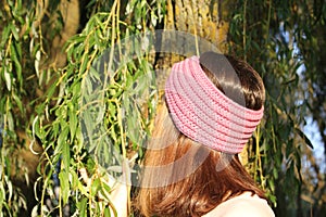 Headbands crocheted knitted on the street on the girl. Product listing for sale. Urban style. Fashion.