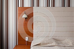 Headboard and bed in a clean hotel room