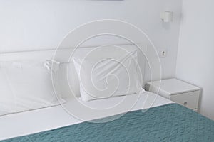 headboard, pillows in a white bed