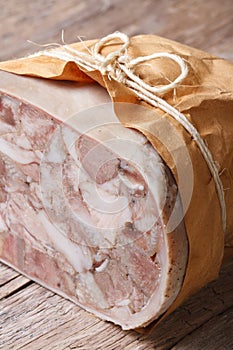 Headcheese tied with twine vertical