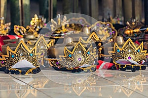 Headdresses of Balinese dancers laying on the floor before the performance.