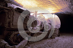 Heading machine in underground salt mine photo