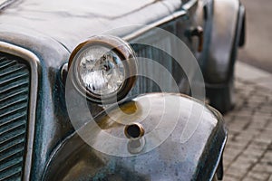 headlamp Retro Bronze car in rain weather.