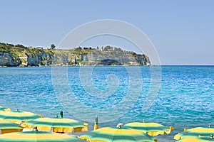 Headland on the blue sea of Tropea area seen from the beach in the south of Italy