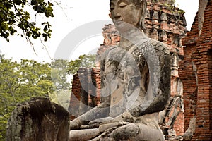 Headless buddha statue in Ayutthaya ruins temple heritage site