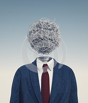 Headless businessman with chaotic wires