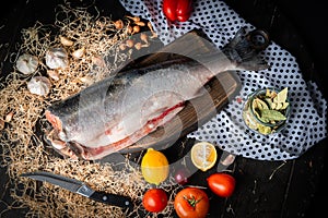 Headless coho salmon with lemons and vegetables